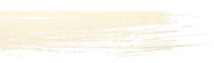 A horizontal brushstroke of pale, shimmering gold paint against a white background