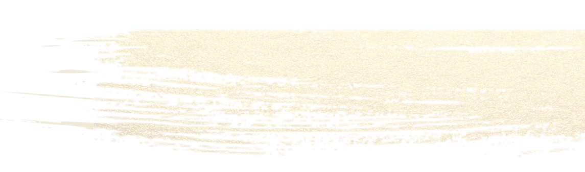 A horizontal brushstroke of pale, shimmering gold paint against a white background.